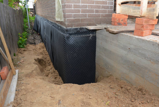 SJ Waterproofing Pros technician performing targeted Exterior Waterproofing assessment in Tekonsha, MI